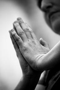 Hand touching a wall in black and white from Beyond Wellness, a chiropractor in Ashburn Virginia