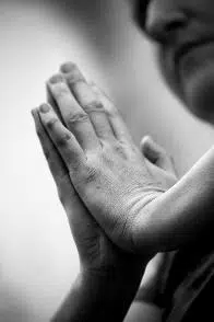 Hand touching a wall in black and white from Beyond Wellness, a chiropractor in Ashburn Virginia