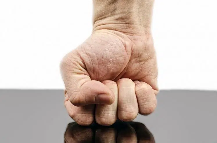 Fist touching a table at Beyond Wellness, a network of chiropractors, acupuncturists, and physical therapists in Ashburn VA